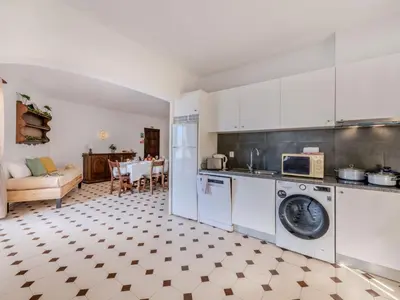 a villa with a swimming pool in front of a house at Apartment T3 capricórnio - VIP Properties by Interhome in Galé