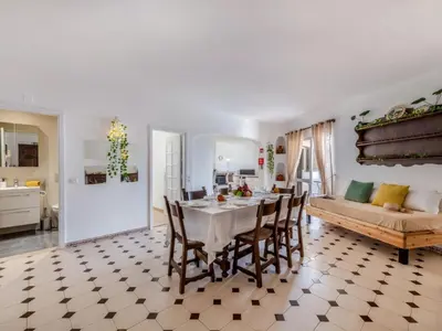 a kitchen with a washing machine and a microwave at Apartment T3 capricórnio - VIP Properties by Interhome in Galé