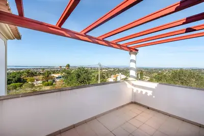 a balcony with a view of the city at Villa Agapito in Terras Novas