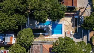 an overhead view of a house with a swimming pool at Açoteias Studio w Pool by LovelyStay in Albufeira