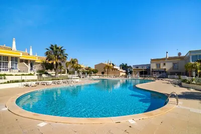an aerial view of a resort with a pool at Ponta Grande Resort - Vila Luzia in Albufeira