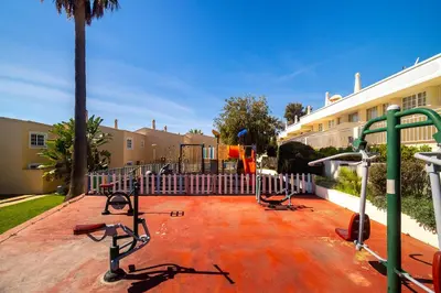 a living room with a couch and a table at Ponta Grande Resort - Villa Ponta in Albufeira