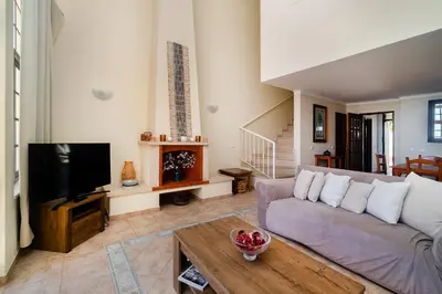 a house with a door and a palm tree at Ponta Grande Resort - Villa Solmar in Albufeira