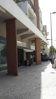 a building on a street in a city at Pórtico de Malpique in Albufeira