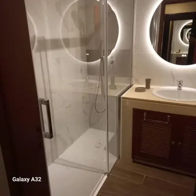 a bathroom with a shower and a sink at Pórtico de Malpique in Albufeira