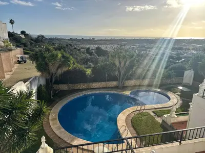 a view of a swimming pool on a balcony at Cliff Enchantment - Pool and Sea View in Albufeira in Albufeira