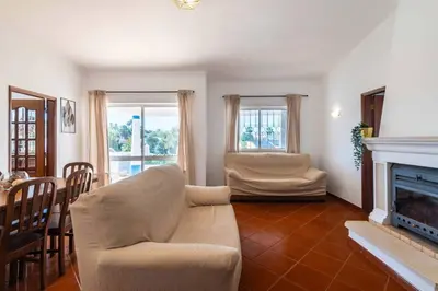 a living room with a couch and a fireplace at Villa Gabriella - Charming villa in great location close to everything you need in Guia