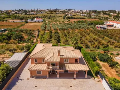 an aerial view of a house with a roof at Villa Hugo - bright modern walk to restaurants in Albufeira