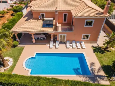 an aerial view of a villa with a swimming pool at Villa Hugo - bright modern walk to restaurants in Albufeira