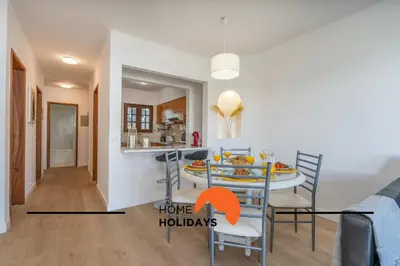 a dining room and kitchen with a table and chairs at #279 T2 Para Relaxar em Albufeira by Home Holidays in Albufeira