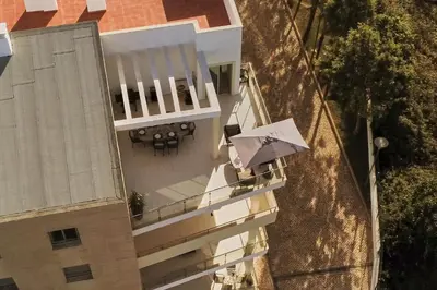 an overhead view of a balcony with an umbrella at Penthouse Monte da Eira - Sunset in Albufeira