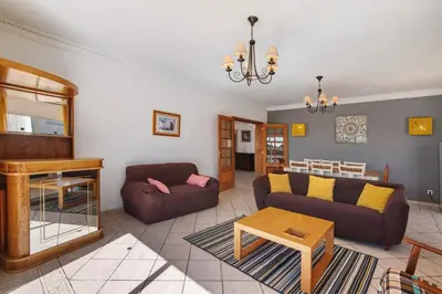 a living room with a couch and a table at Breeze Villa - Adults Only in Albufeira