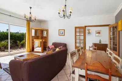 a living room with a couch and a table at Breeze Villa - Adults Only in Albufeira