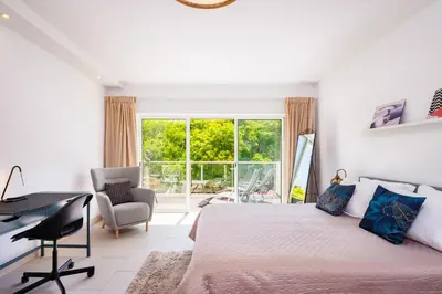 a bedroom with a bed and a desk and a window at Albufeira - Anna Town - NEW in Albufeira