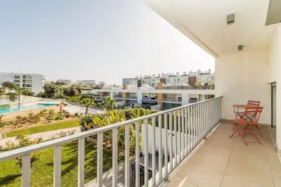 a balcony with a view of the city at Family Villa 3 Bedrooms private rooftop with Pool in Albufeira