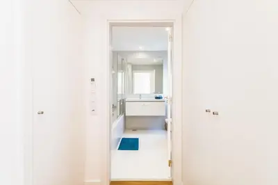 a bathroom with a sink and a mirror at Family Villa 3 Bedrooms private rooftop with Pool in Albufeira