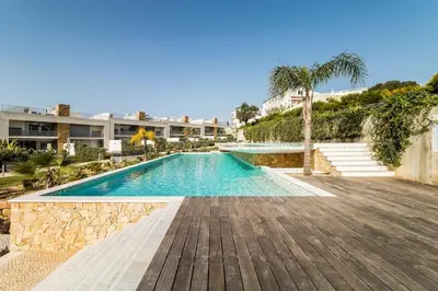 a swimming pool in the middle of a resort at Family Villa 3 Bedrooms private rooftop with Pool in Albufeira