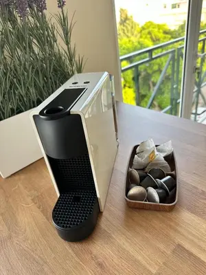 a toaster sitting on a table next to a box of rocks at Alagoas Studio - City Center in Faro