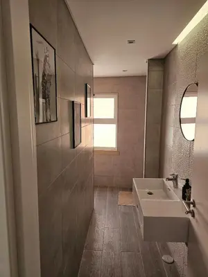 a bathroom with a sink and a mirror at Oldtown Nightlife 2 in Faro
