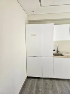 a white kitchen with white cabinets and a sink at Oldtown Nightlife 2 in Faro