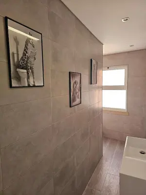 a bathroom with a toilet and a sink and a mirror at Oldtown Nightlife 2 in Faro