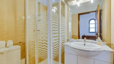 a bathroom with a sink and a shower at Villa Rique in Albufeira