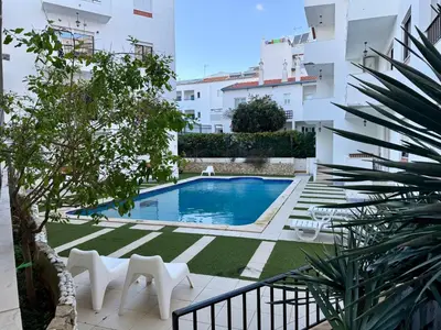 a swimming pool in the middle of a building at Apartamento Flor de Amendoeira Mar in Albufeira