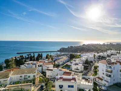 an aerial view of a city and the ocean at Atlantic Apartment in Albufeira