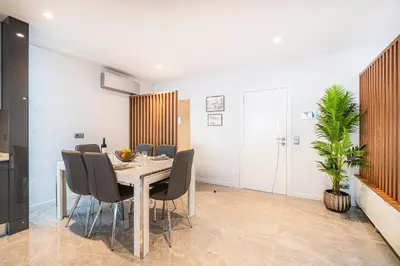 a dining room with a table and chairs at Old Town Charm Apartment in Albufeira