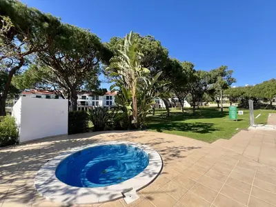 a blue frisbee sitting on top of a patio at Vilamoura Sunny Garden With Pool by Homing in Vilamoura