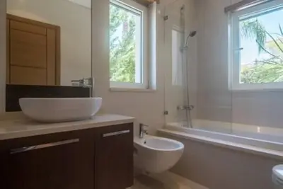 a bathroom with a sink and a toilet and a shower at Crest 5 - 8 Pax Golf & Beach Swimming pool in Almancil