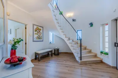 a hallway with a staircase in a house at Casa Maré Viva in Guia