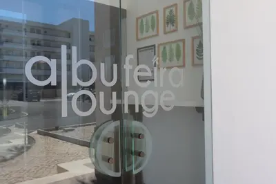 a sign on a glass door of a building at Albufeira Lounge Hotel in Albufeira