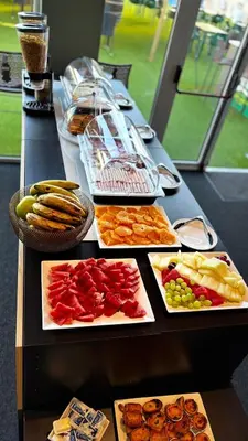 a long table with different types of food on it at Albufeira Lounge Hotel in Albufeira