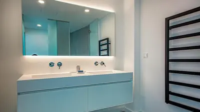 a bathroom with a sink and a mirror at Algarve Villa for Contemporary Design & Sea Views in Albufeira