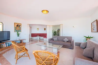 a living room with a couch and a table at Villa Atlantida by Atlantic Places in Albufeira