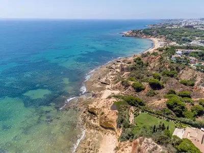 an aerial view of a beach and the ocean at Studio on Maria Luisa Beach Wifi Parking Swimming Pool in Olhos de Água