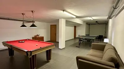 a living room with a pool table and a couch at Noly by Check-in Portugal in Albufeira