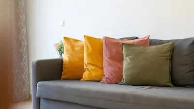 a group of pillows sitting on a couch at Sunny Retreat with Pool and Balcony by LovelyStay in Albufeira