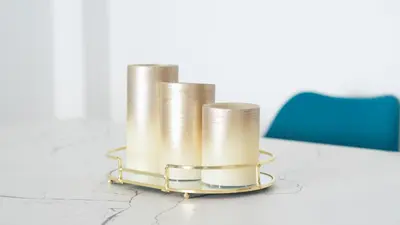 a set of three metal cylinders sitting on a table at Sunny Retreat with Pool and Balcony by LovelyStay in Albufeira
