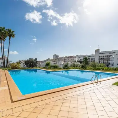 Sunny Retreat with Pool and Balcony by LovelyStay
