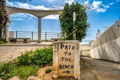 a sign that reads path to the beach at Varandas do Mar, Olhos de Agua, 1 Bed Apt AT23 in Olhos de Água