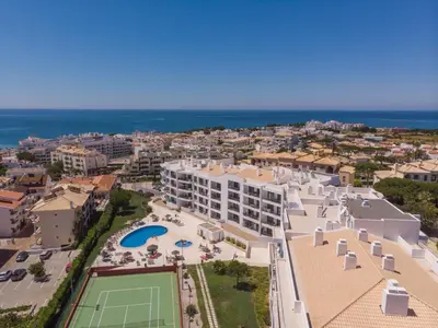 an aerial view of a resort with a tennis court at Vista Das Ondas 308 By RS in Olhos de Água