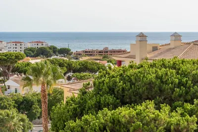 a view of a city with trees and the ocean at Vista Das Ondas 308 By RS in Olhos de Água