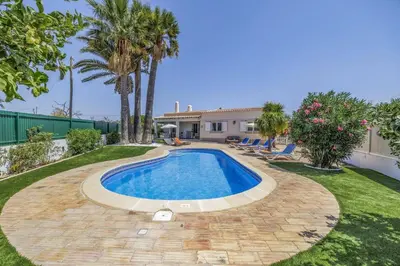 a swimming pool in the yard of a house at Villa Domus Vini by Villa Plus in Guia