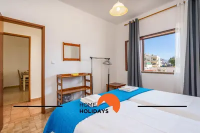 a bedroom with a bed and a room with a window at #241 Old Town - Casa de Albufeira 1 by Home Holidays in Albufeira