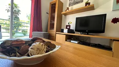 a living room with a television and a bowl on a table at Apartment Josefa in Albufeira
