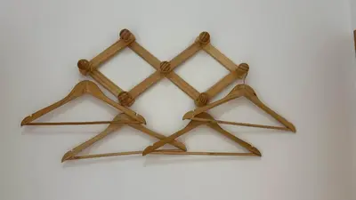 a group of four wooden crosses hanging on a wall at Apartment Josefa in Albufeira
