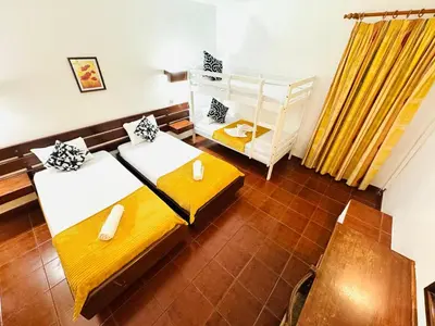 a room with two beds and a table at Resort Albufeira Praia Oura in Albufeira