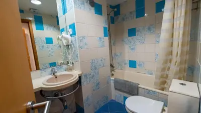 a bathroom with a sink and a toilet at Marina 3B 1B By AL in Albufeira